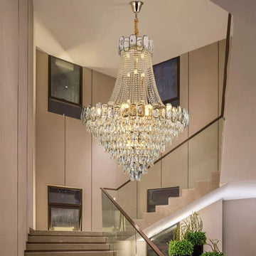 https://cdn.shopify.com/s/files/1/0736/8795/7790/files/foyer-staircase-chandelier-luxury-k9-crystal-ceiling-light-for-living-room-hallway-merlin-lamps.jpg?v=1765361000